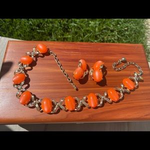 Unsigned set of bracelet and ear studs. Pristine condition